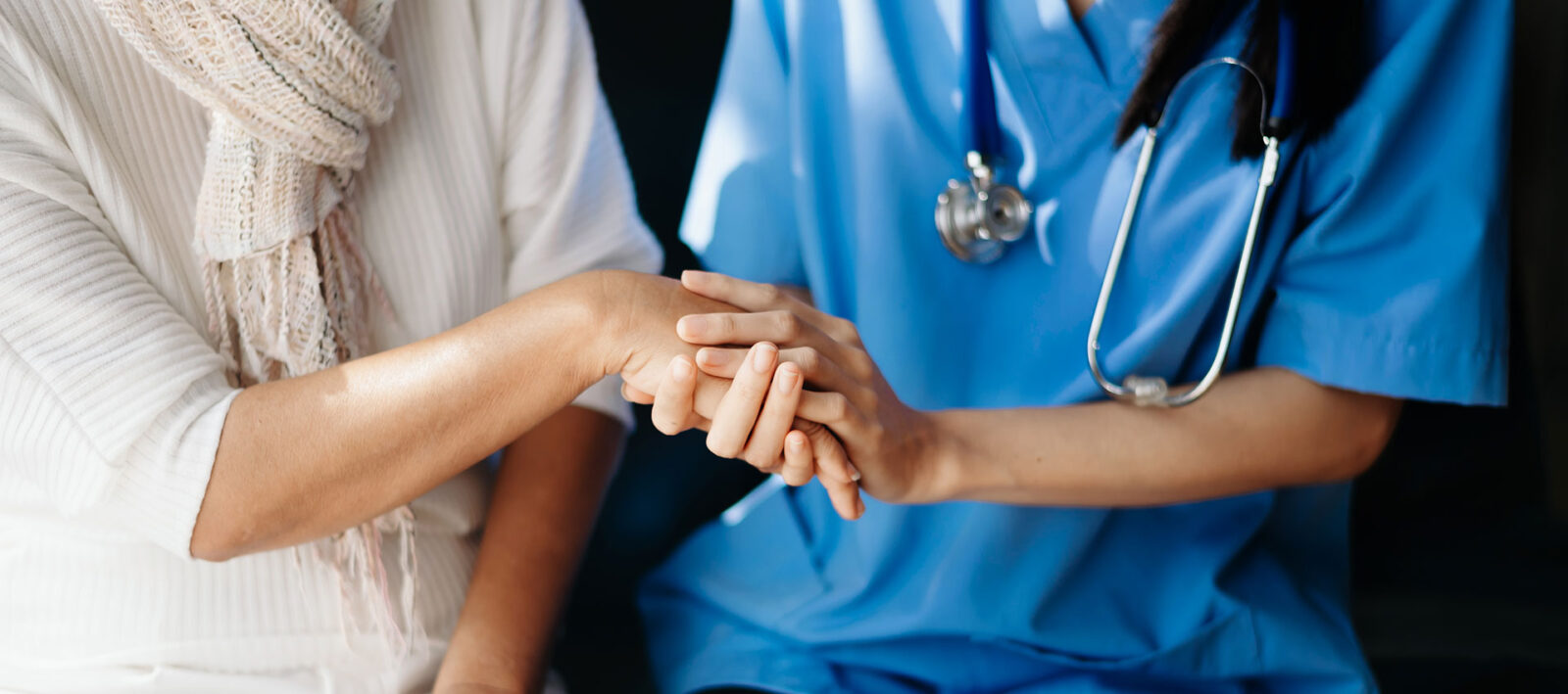 Kind nurse together with elderly woman in the hospital's or home